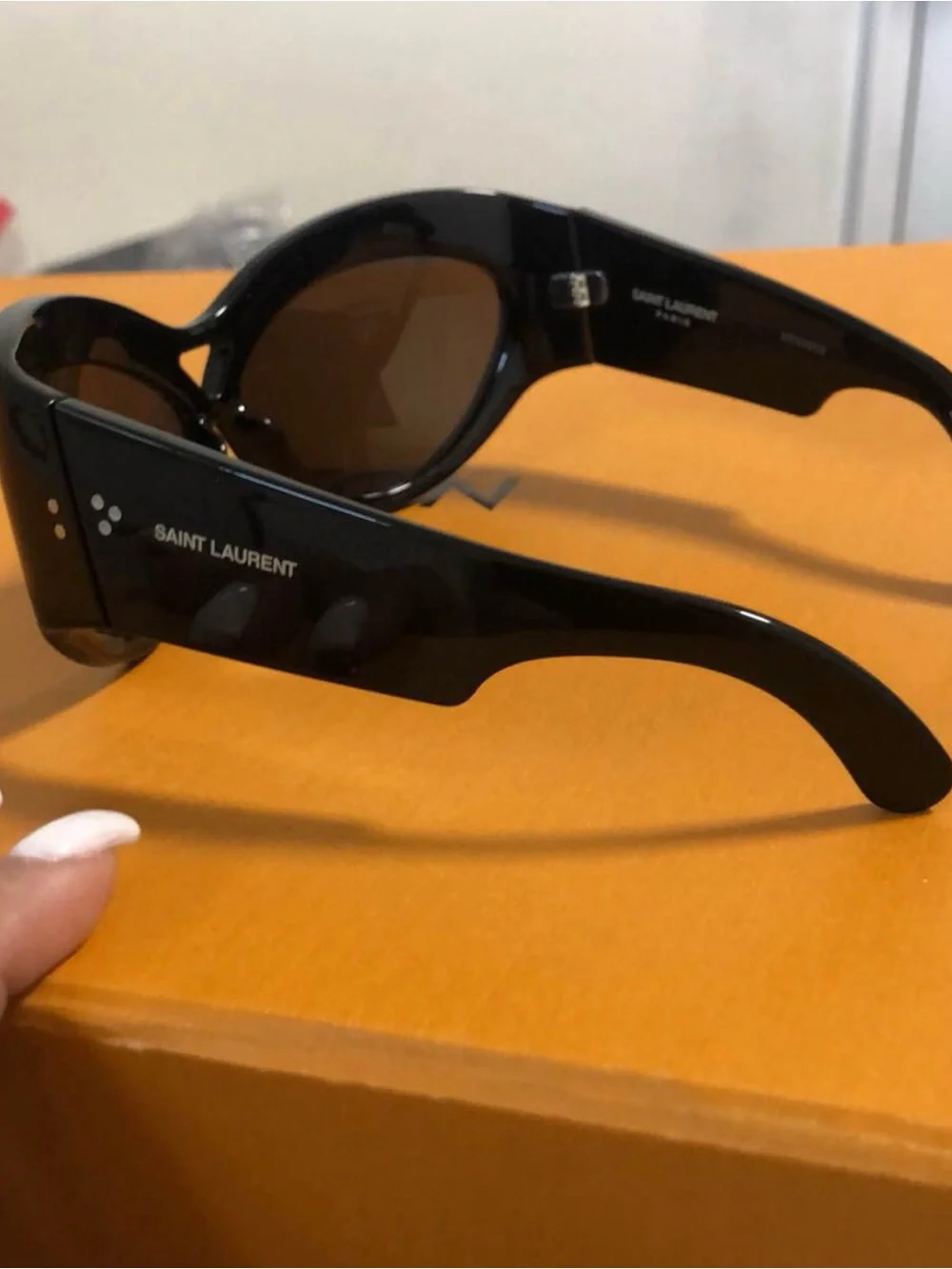 Yves Saint Laurent Black Women's Oval Sunglasses with Dark Lenses